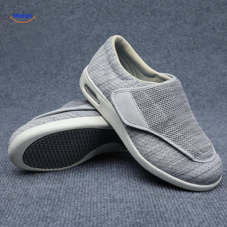 Light gray support shoes with protective rubber sole traction.