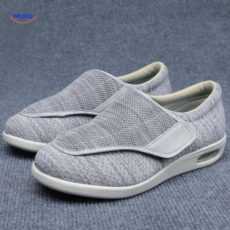 Light gray comfort shoes with secure velcro band fastening.