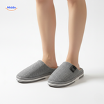 Women's light gray slippers with durable non-slip sole.