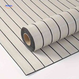 Light grey self-adhesive slat wall panels rolled out showing full surface coverage.