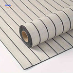 Light grey self-adhesive slat wall panels rolled out showing full surface coverage.
