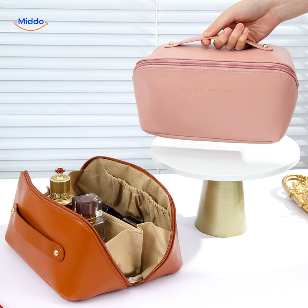 Light pink waterproof pouch filled with travel essentials
