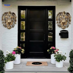 Golden lion head resin sculpture mounted on an entryway wall with modern home decor.