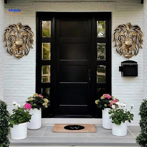 Golden lion head resin sculpture mounted on an entryway wall with modern home decor.