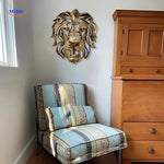 Resin lion head sculpture displayed in a stylish living room wall installation.