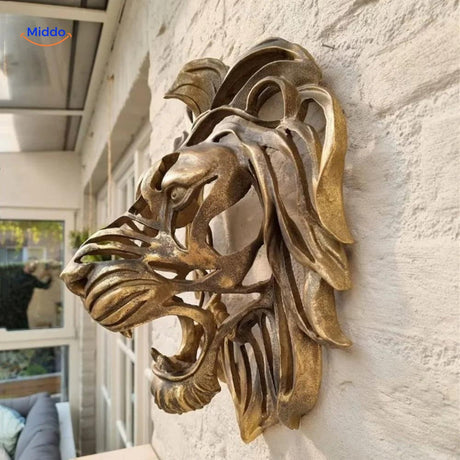 Lion head wall sculpture shown from the side, revealing dimensional sculptural detail and depth.