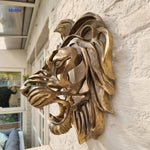Lion head wall sculpture shown from the side, revealing dimensional sculptural detail and depth.