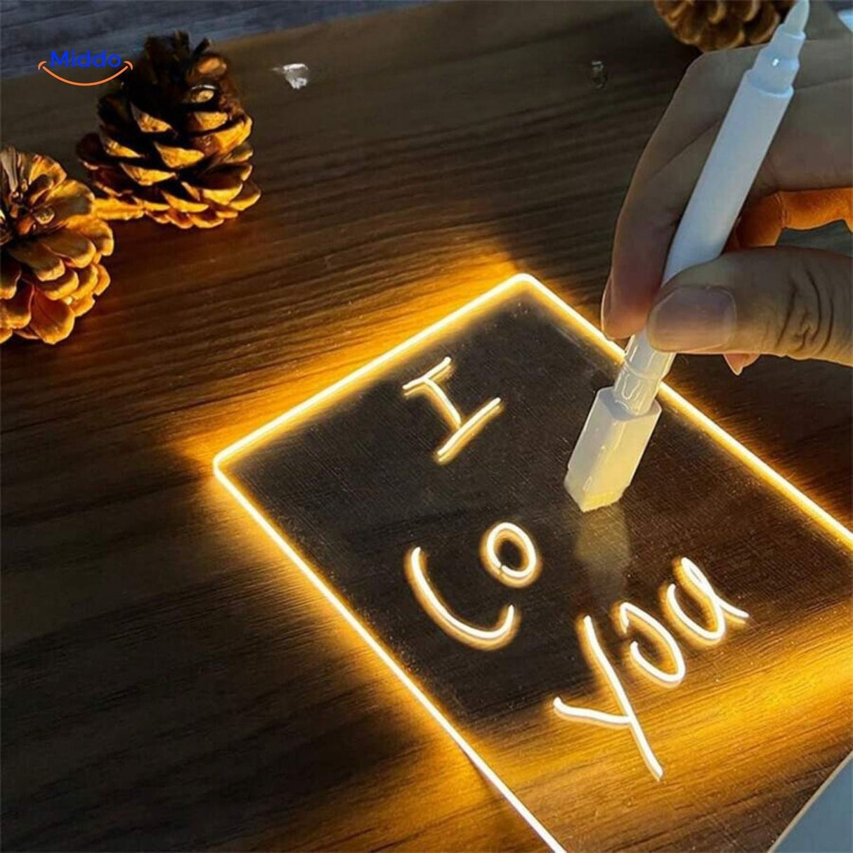 Writing with dry erase marker on illuminated LumiNote desk lamp memo board surface.