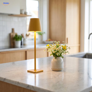 Yellow Lumiset table lamp on a kitchen counter