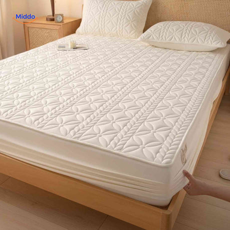 Luxury quilted mattress protector combining softness with waterproof protection.