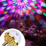 Colorful disco ball light creating ambiance in a living room setting.