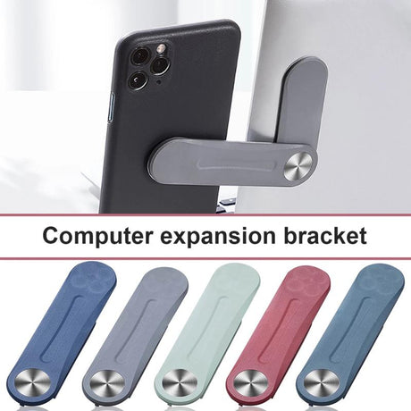 MagnetClip phone mount available in multiple color variants for home office setup.
