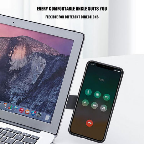 MagnetClip holding smartphone during video conference call on laptop workstation.