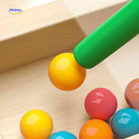 Close-up detail of magnetic balls in the maze game.