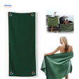 Green microfiber beach towel with magnetic corners for secure placement.