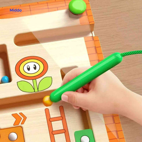Magnetic pen control game with colorful beads on wooden maze.