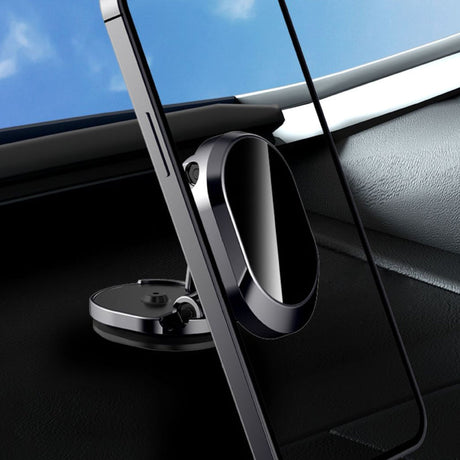 Magnetic phone holder mounted on a car dashboard keeping the phone secure while driving.