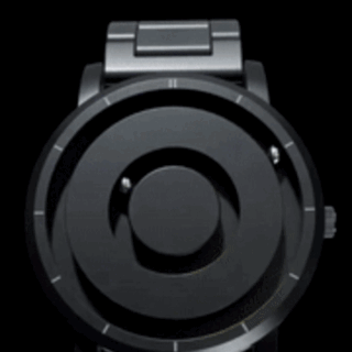 Modern black magnetic watch with floating sphere hands and sleek design.