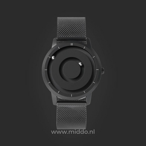 Black magnetic watch with minimalist dial and clean aesthetic design.