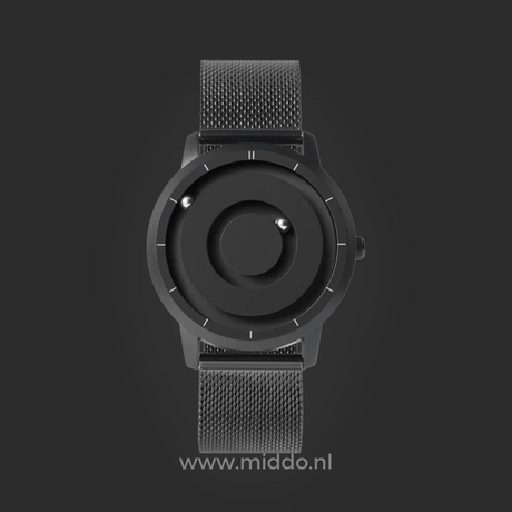 Black magnetic watch with minimalist dial and clean aesthetic design.