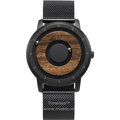Black magnetic watch with warm wooden dial and natural accents.