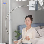 Magnetic window cleaner in action cleaning tall high-rise apartment windows safely and easily.