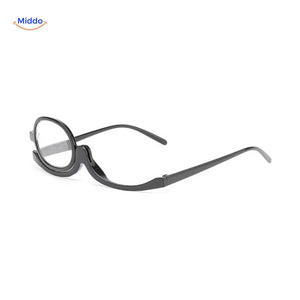 Glossy black rotating makeup reader glasses with single-lens design.