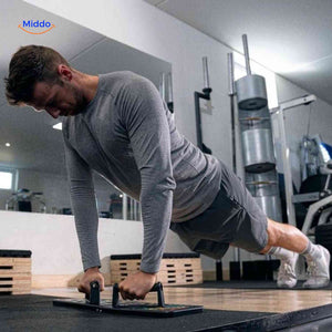 Man performing push-ups on the board using the ergonomic grip handles.