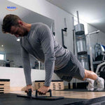 Man performing push-ups on the board using the ergonomic grip handles.