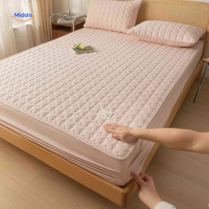 Mattress protector with adjustable elastic corner straps for custom height fitting.