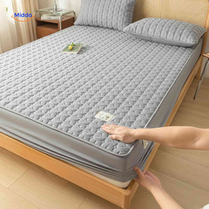 Mattress protector with elastic corners and anti-slip base for secure positioning.