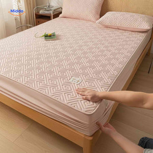 Thin quilted top layer mattress protector offering comfort and waterproof protection.