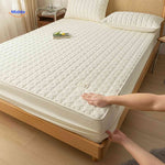 Two-layer quilted mattress protector combining comfort with waterproof protection.