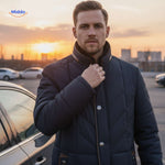 Man in quilted jacket at sunset, highlighting stand-up collar design.