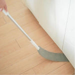 Extended duster cleaning dust behind and under refrigerator.