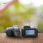 Portable mini camera in pink with fresh flowers lifestyle setting