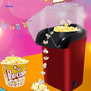 Mini electric popcorn maker filled with fresh popcorn kernels.
