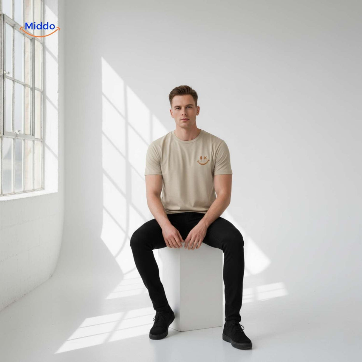 Beige cotton t-shirt with smiley print styled in minimalist men's fashion.