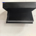 Black wall shelf with secure storage featuring closed lid and lower door.