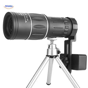 Night vision monocular mounted on tripod with smartphone compatibility.