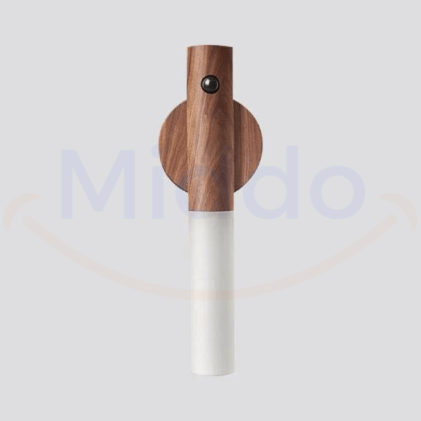 Motion-activated LED lamp illuminating dark room with white light for night visibility.