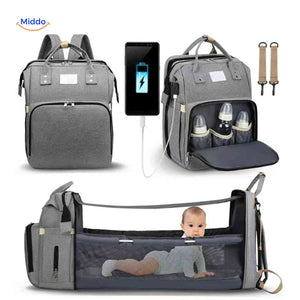 Multifunctional diaper backpack with foldable bassinet and integrated USB charging.