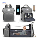 Multifunctional diaper backpack with foldable bassinet and integrated USB charging.