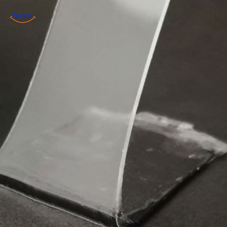 Clear NanoGrip double-sided tape showing strong adhesive strength.