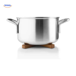 Natural wooden trivet supporting hot stainless steel pan safely.