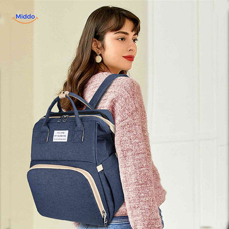 Navy blue fashion-forward diaper backpack designed for modern mothers.