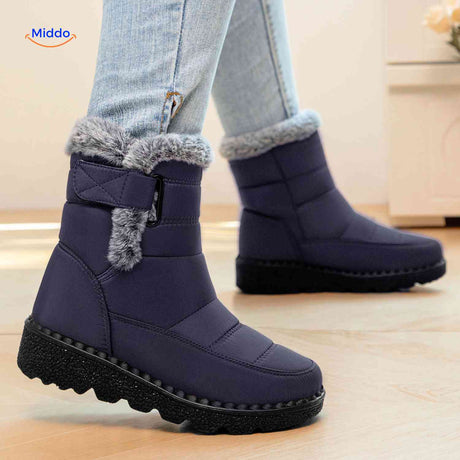 Navy blue winter boots designed for comfort in snow.