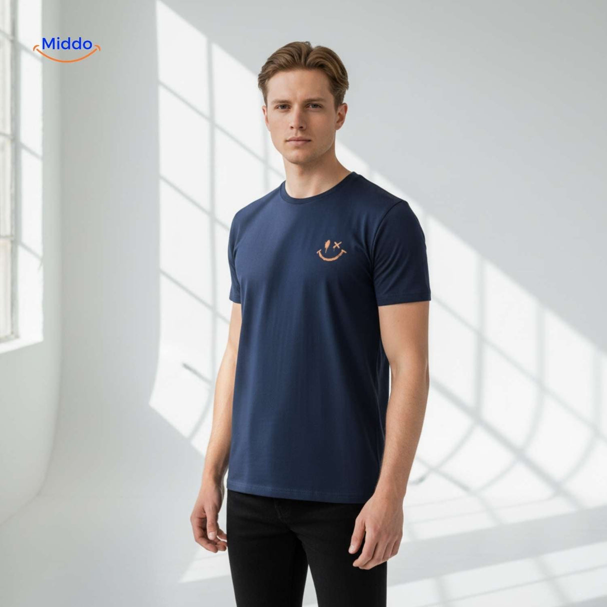 Side view of navy cotton t-shirt with smiley logo detail.