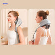 Woman wearing gray RelaxPro neck and shoulder massager for pain relief.