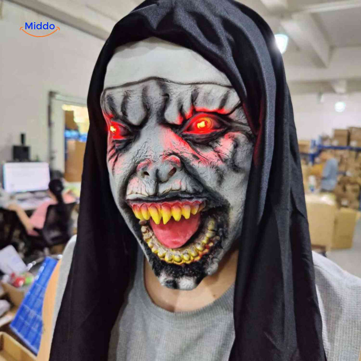 Nun mask with glowing red LED eyes and terrifying expression.